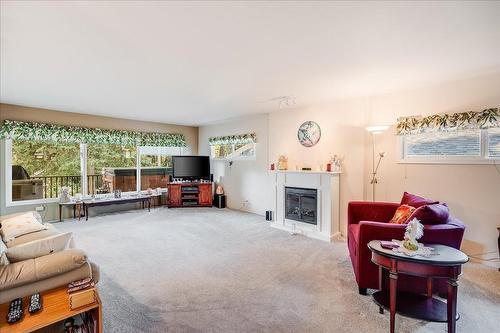 101 Cedar Avenue, Fruitvale, BC - Indoor Photo Showing Living Room With Fireplace