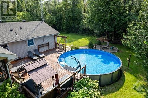 908 River Road, North Grenville, ON - Outdoor With Above Ground Pool With Backyard