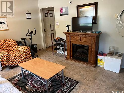 128 1St Avenue S, Coronach, SK - Indoor Photo Showing Living Room With Fireplace