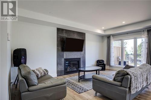 2963 Windstar Avenue, Chelmsford, ON - Indoor Photo Showing Living Room With Fireplace