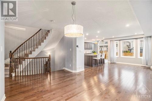 Stunning stairs to the second floor! Elegant dining area with a chandelier, perfect for gatherings. - 445 Barrick Hill Road, Ottawa, ON - Indoor