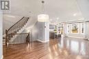 Stunning stairs to the second floor! Elegant dining area with a chandelier, perfect for gatherings. - 445 Barrick Hill Road, Ottawa, ON  - Indoor 