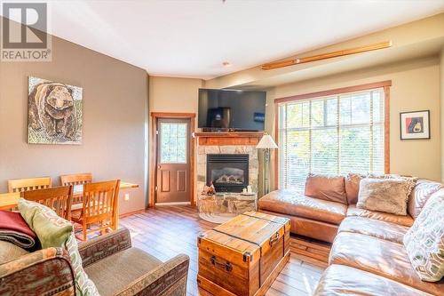 5258 Highline  Drive Unit# 119, Fernie, BC - Indoor Photo Showing Living Room With Fireplace