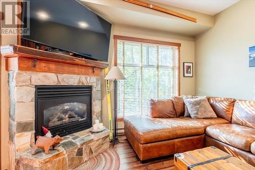 5258 Highline  Drive Unit# 119, Fernie, BC - Indoor Photo Showing Living Room With Fireplace