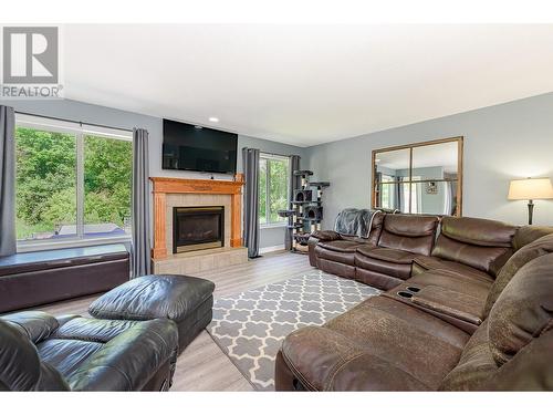 160 Carlin Street, Grindrod, BC - Indoor Photo Showing Living Room With Fireplace