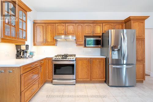 62 Fletcher Crescent, New Tecumseth, ON - Indoor Photo Showing Kitchen