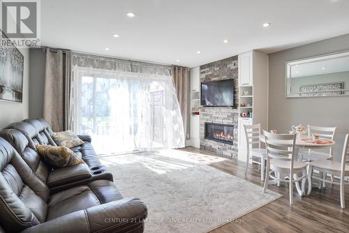 35 - 21 Laguna Parkway, Ramara (Brechin), ON - Indoor Photo Showing Living Room With Fireplace