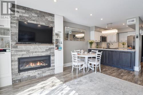 35 - 21 Laguna Parkway, Ramara (Brechin), ON - Indoor Photo Showing Living Room With Fireplace