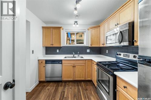 36 4640 Harbour Landing Drive, Regina, SK - Indoor Photo Showing Kitchen With Double Sink