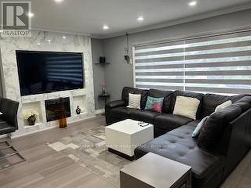 21 Benway Drive, Toronto (Rexdale-Kipling), ON - Indoor Photo Showing Living Room With Fireplace