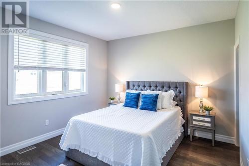 Main Floor Primary Bedroom with Wall In Closet - 403 Normanton Street, Port Elgin, ON - Indoor Photo Showing Bedroom