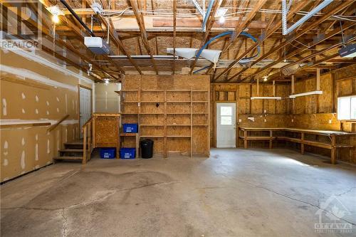 2 car garage with 2 auto door openers - 304 Cedar Crest Drive, Carleton Place, ON - Indoor Photo Showing Garage