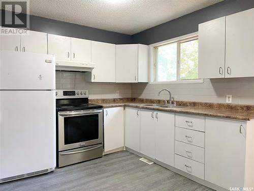 2219B Coy Avenue, Saskatoon, SK - Indoor Photo Showing Kitchen With Double Sink