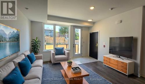 12 - 1479 O'Connor Drive, Toronto, ON - Indoor Photo Showing Living Room