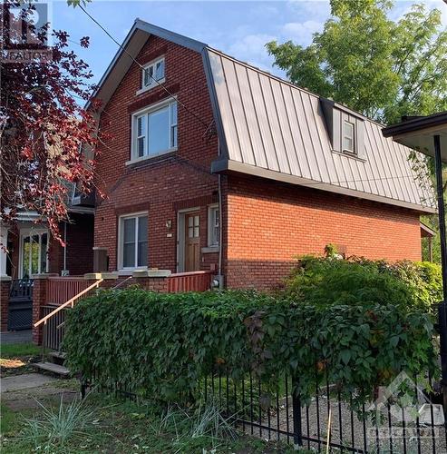 View of side of house with new steel roof. - 177 Hinton Avenue N, Ottawa, ON - Outdoor