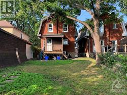 Back exterior with covered porch. - 