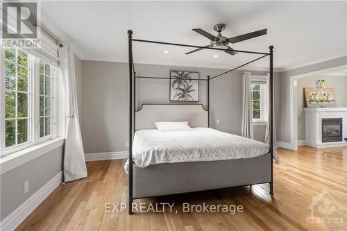 6131 Pebblewoods Drive, Ottawa, ON - Indoor Photo Showing Bedroom With Fireplace