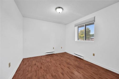 Primary bedroom with window overlooking balcony - 482 James Street N Unit# 203, Hamilton, ON - Indoor Photo Showing Other Room