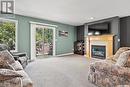 17 110 Banyan Crescent, Saskatoon, SK  - Indoor Photo Showing Living Room With Fireplace 