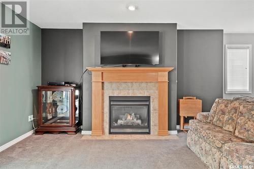 17 110 Banyan Crescent, Saskatoon, SK - Indoor Photo Showing Living Room With Fireplace