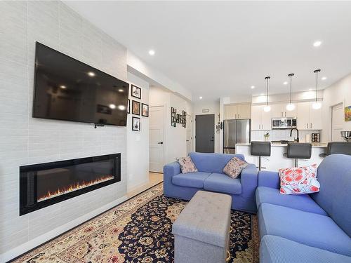 401-958 Pharoah Mews, Langford, BC - Indoor Photo Showing Living Room With Fireplace