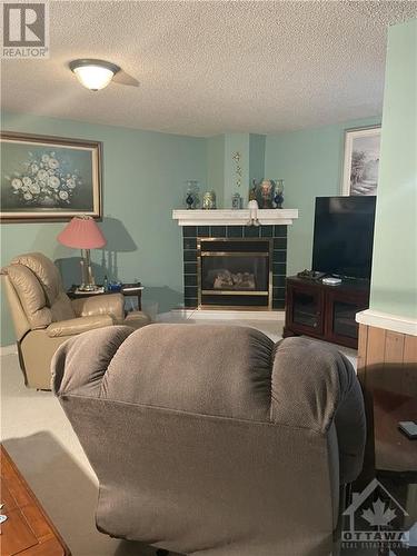 Rec Room - 167 Edward Street S, Arnprior, ON - Indoor Photo Showing Living Room With Fireplace