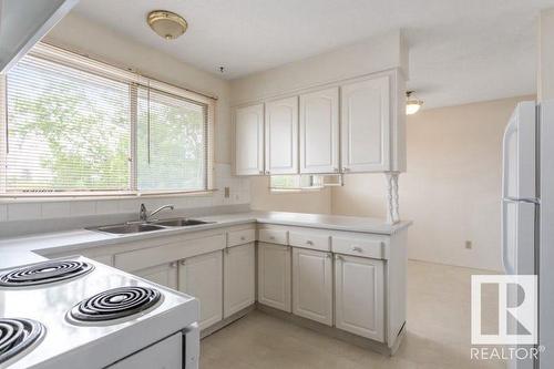 6116 40 Av Nw, Edmonton, AB - Indoor Photo Showing Kitchen With Double Sink