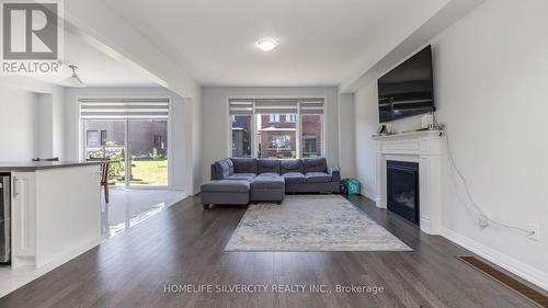 940 Sobeski Avenue, Woodstock, ON - Indoor Photo Showing Living Room With Fireplace