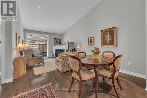 4 Toulon Avenue, Hamilton (Ancaster), ON - Indoor Photo Showing Dining Room With Fireplace