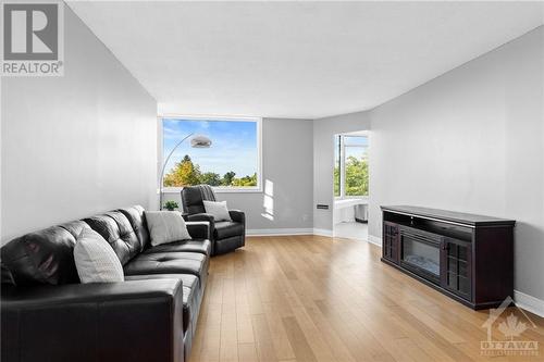 1025 Grenon Avenue Unit#416, Ottawa, ON - Indoor Photo Showing Living Room With Fireplace