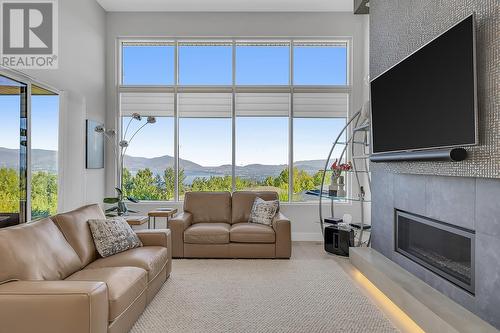 484 Sparrow Hawk Court, Kelowna, BC - Indoor Photo Showing Living Room With Fireplace