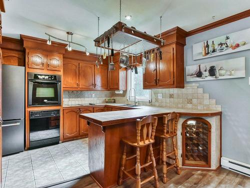 Cuisine - 18360 Rue Charles, Mirabel, QC - Indoor Photo Showing Kitchen With Double Sink