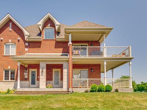 Frontage - 295 Rue De Barcelone, Dollard-Des-Ormeaux, QC - Outdoor With Balcony With Facade