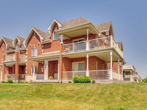 Exterior - 295 Rue De Barcelone, Dollard-Des-Ormeaux, QC - Outdoor With Balcony With Facade