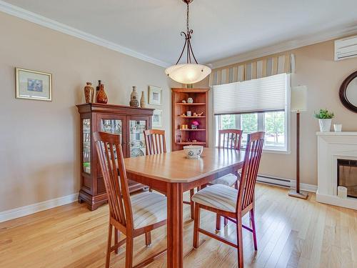 Dining room - 295 Rue De Barcelone, Dollard-Des-Ormeaux, QC - Indoor Photo Showing Dining Room With Fireplace