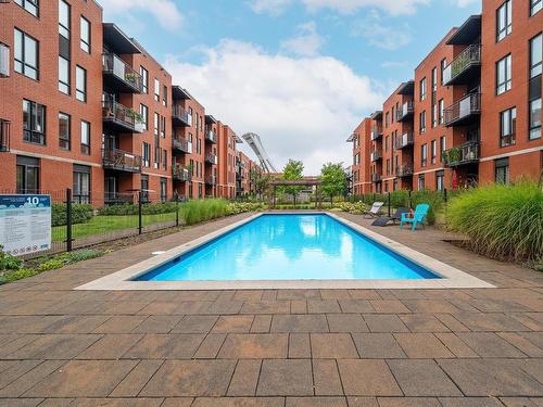 Pool - 403-4550 Rue Hochelaga, Montréal (Mercier/Hochelaga-Maisonneuve), QC - Outdoor With In Ground Pool With Balcony