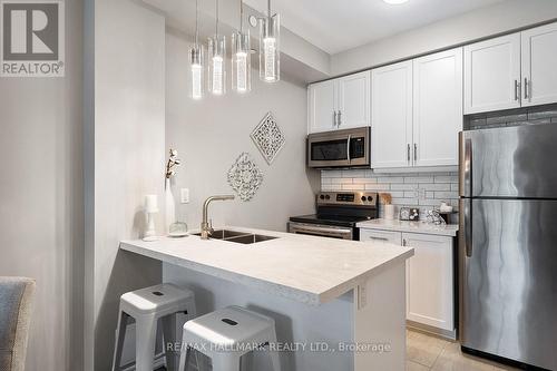 103 - 84 Aspen Springs Drive, Clarington (Bowmanville), ON - Indoor Photo Showing Kitchen With Stainless Steel Kitchen