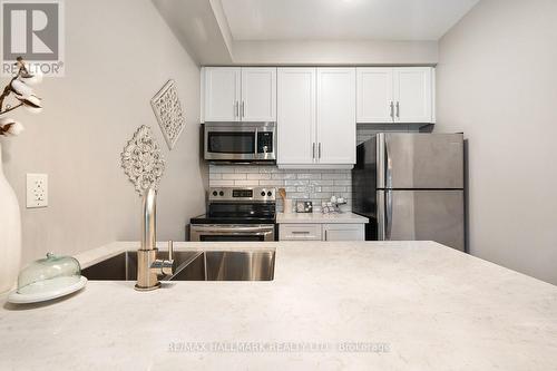 103 - 84 Aspen Springs Drive, Clarington (Bowmanville), ON - Indoor Photo Showing Kitchen With Stainless Steel Kitchen With Double Sink