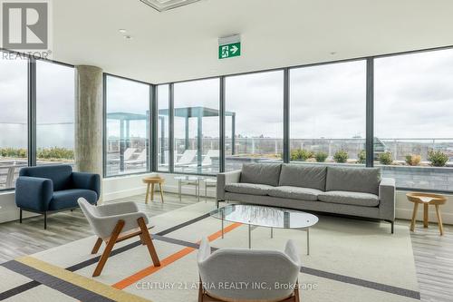 202 - 150 Logan Avenue, Toronto (South Riverdale), ON - Indoor Photo Showing Living Room