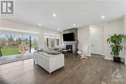 2500 Kearns Way, Greely, ON - Indoor Photo Showing Living Room With Fireplace