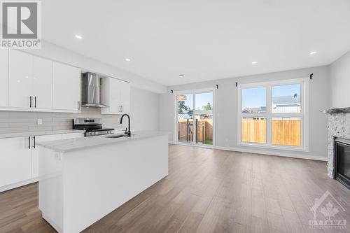 875 Contour Street Unit#B, Ottawa, ON - Indoor Photo Showing Kitchen With Fireplace