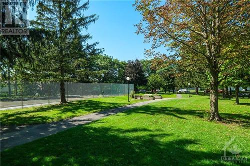 Relax with a book on the park benches on the condo grounds. - 665 Bathgate Drive Unit#1401, Ottawa, ON - Outdoor