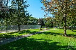 Relax with a book on the park benches on the condo grounds. - 