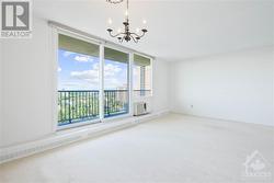 Living Rm/Din with patio doors to balcony and spectacular view and natural light.  Note professionally neutrally painted. - 