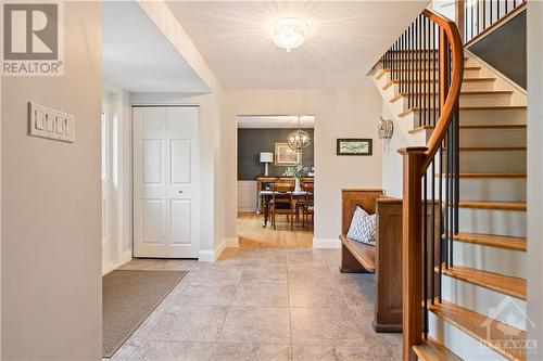 Front foyer with cherry banister and oak hardwood staircase to 2nd level - 10 Riverbrook Road, Ottawa, ON - Indoor Photo Showing Other Room