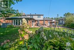 View of rear of home from huge back yard - 