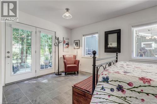 Studio bedroom with exterior garden doors - 220 Belcher Lane, Southampton, ON - Indoor Photo Showing Bedroom