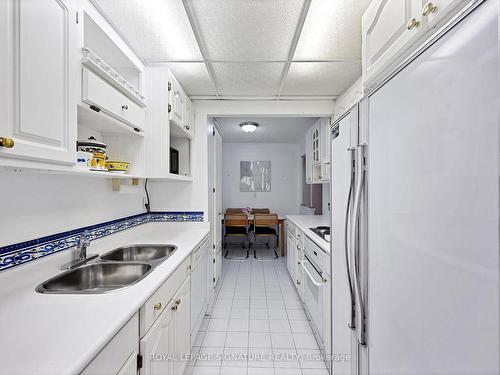 704-812 Burnhamthorpe Rd, Toronto, ON - Indoor Photo Showing Kitchen With Double Sink