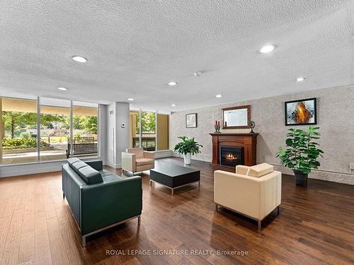 704-812 Burnhamthorpe Rd, Toronto, ON - Indoor Photo Showing Living Room With Fireplace