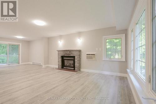 24 Parkside Avenue, South Bruce Peninsula, ON - Indoor Photo Showing Living Room With Fireplace